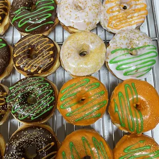 a variety of donuts on a cooling rack