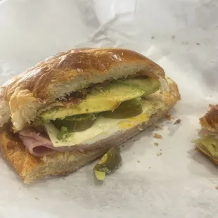 this is a bacon turkey egg and cheese croissant, this shit is bomb ASF  it has, avacado mayo and jalapeños ‍