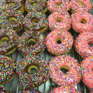 a variety of sprinkles on a cooling rack