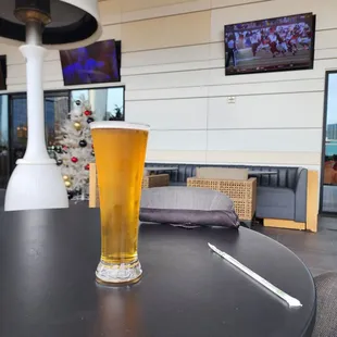 a glass of beer on a table