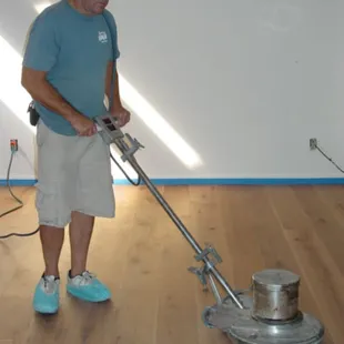 Me buffing in Rubio Monocoat finish on a white oak floor.
