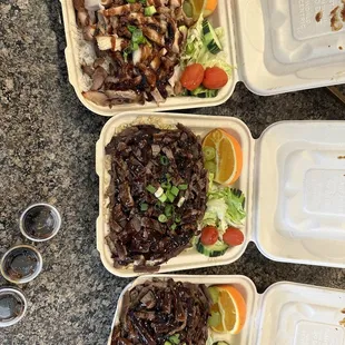 a variety of food items in styrofoam containers