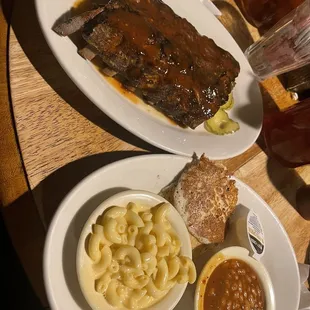 Half rack of ribs with Mac and cheese, and baked beans. HoeCake as well