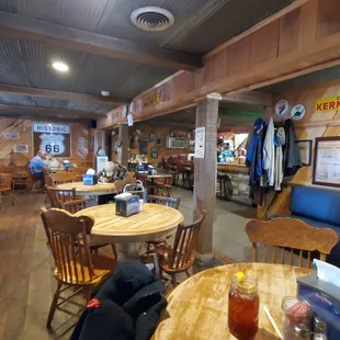 Main dining room area with front counter pictured here towards the back. Call in orders and payments can be made there.