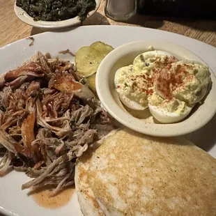 Pork plate with hoecakes, deviled eggs, and turnip greens.