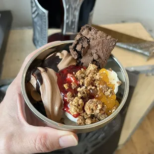 Delicious frozen yogurt topped with homemade brownies, cherry pie, and granola. Yum!