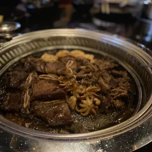 Short ribs, beef tongue, spicy octopus, and garlic shrimp.