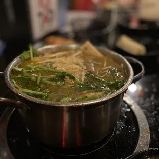 a hot pot of soup