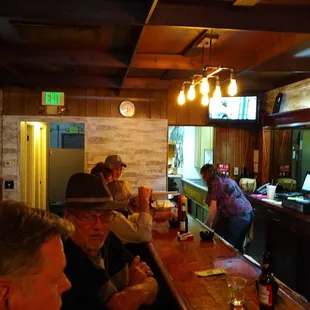 people sitting at the bar