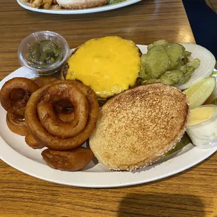 My 1/2 pound burger with yummy onion rings...&amp; jalapeños with xrtra pickles