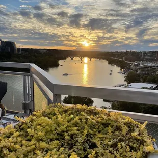 the sun setting over the water