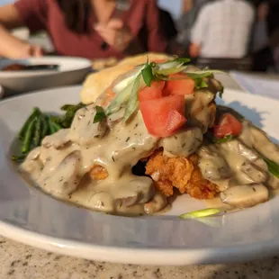 Buttermilk Fried Chicken. $18.50. Locally-sourced breast, mushroom cream gravy, tomato, scallions, mashed potatoes, French beans, biscuit.