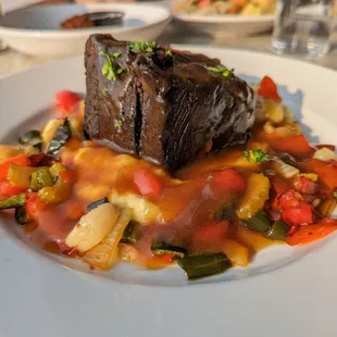 TOPO Whiskey &amp; Coke Braised Beef. $23.99. Boneless beef short rib slow-braised with roasted vegetables and mashed potatoes.