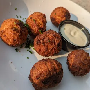 Jalapeno-Cheddar Hushpuppies. 6 for $6.99. Cornmeal hush puppies with jalapeno, cheddar cheese, buttermilk served with white cocktail sauce.