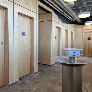 "Restrooms for Everyone" Urinal stalls, toilet stalls, and sinks in the middle!