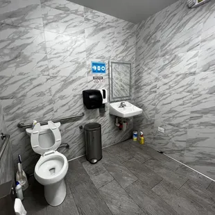 Modern bathroom with LED mirror. Press a blue button to switch on the light.