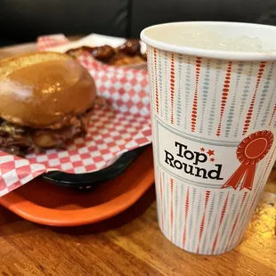 a burger and a cup of coffee