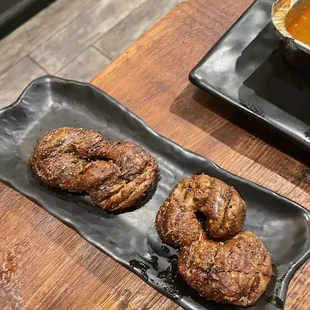two plates of food on a wooden table