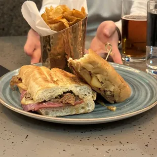 a plate with a sandwich and chips
