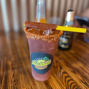 a drink with a yellow straw