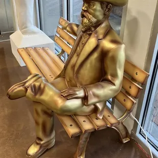  a man sitting on a bench