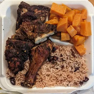 Jerk chicken with yams and rice and beans