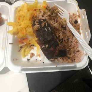 Jerk chicken with rice and beans and cabbage