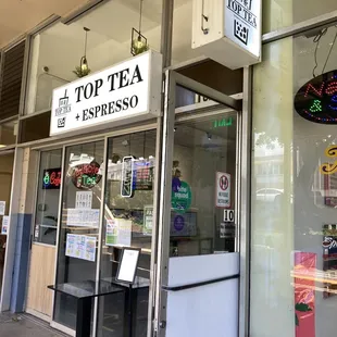 Facade of the tiny shop. Arrows on the floor will guide you around .