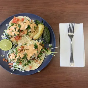 Two Fish Tacos.
Descent size, more vegetables and tasty chipotle sauce.