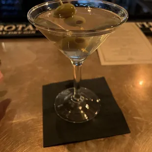 a martini with olives in it