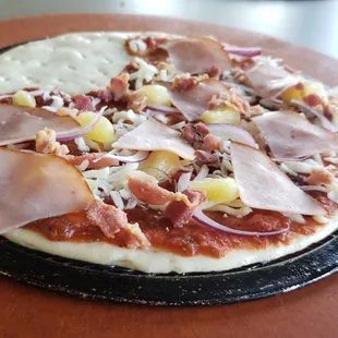 a pizza on a wooden board