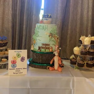 A two tier cake. And 3 different kinds of cupcakes.