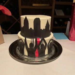 a cake with hands on it