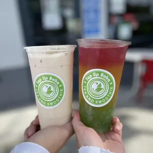 two cold drinks in plastic cups
