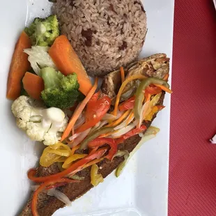 Escovitch fish rice and pease and steamed veggies