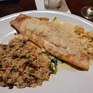 Broiled Redfish w/pecan rice and topped with limp crab meat lemon sauce