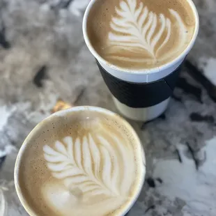 two cups of coffee on a table