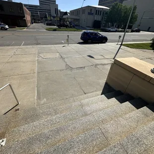 Another view of the dilapidated stairs and sidewalk.