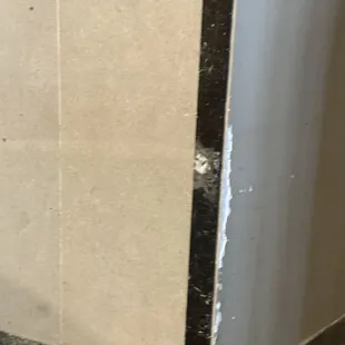 This is damage to the corner of where two walls meet. It is another symbol of how in disrepair this place is!