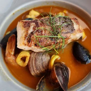 Bouillabaisse - Provençal fish stew, red snapper, branzino, clams, shrimp, squid, mussels, saffron rouille