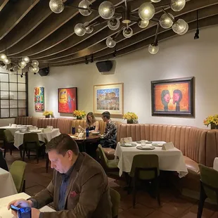 a man sitting at a table in a restaurant