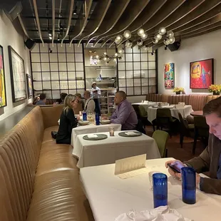 a man sitting at a table in a restaurant