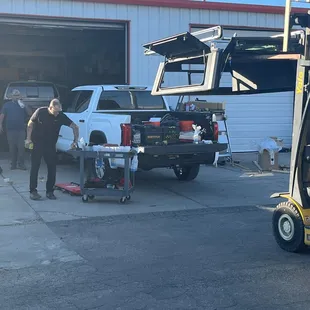 Staff installing new top Tobias Handyman