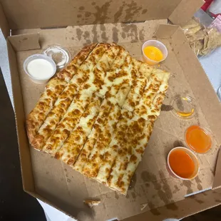a slice of cheese pizza in a box
