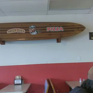 a surfboard mounted on the wall