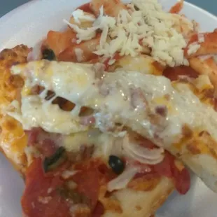 a slice of pizza on a plate