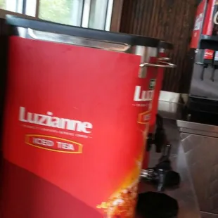 ows a red beverage dispenser