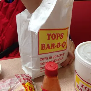 ows a hot dog and a bag of toppings