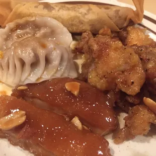 Clockwise from top: Home style roll, black pepper chicken, peanut chicken, dumpling
