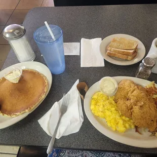 Pancake, cheese eggs, catfish, hashbrowms, coffee, wheat toast and water
